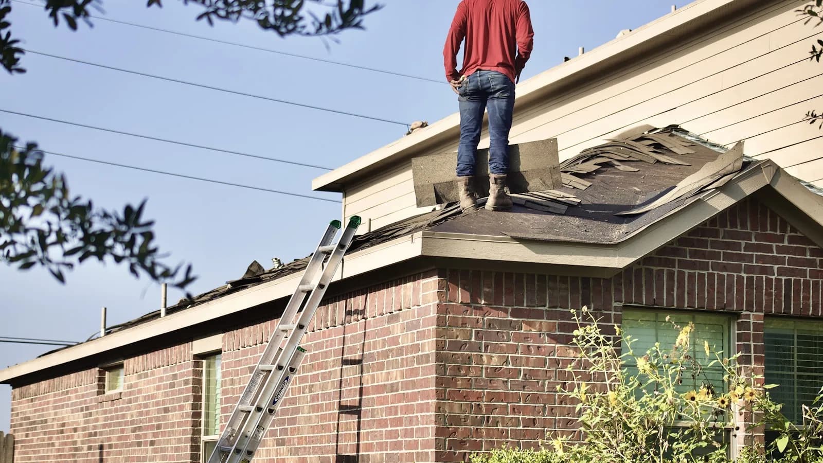 Roofing professional working on a residential roof installation